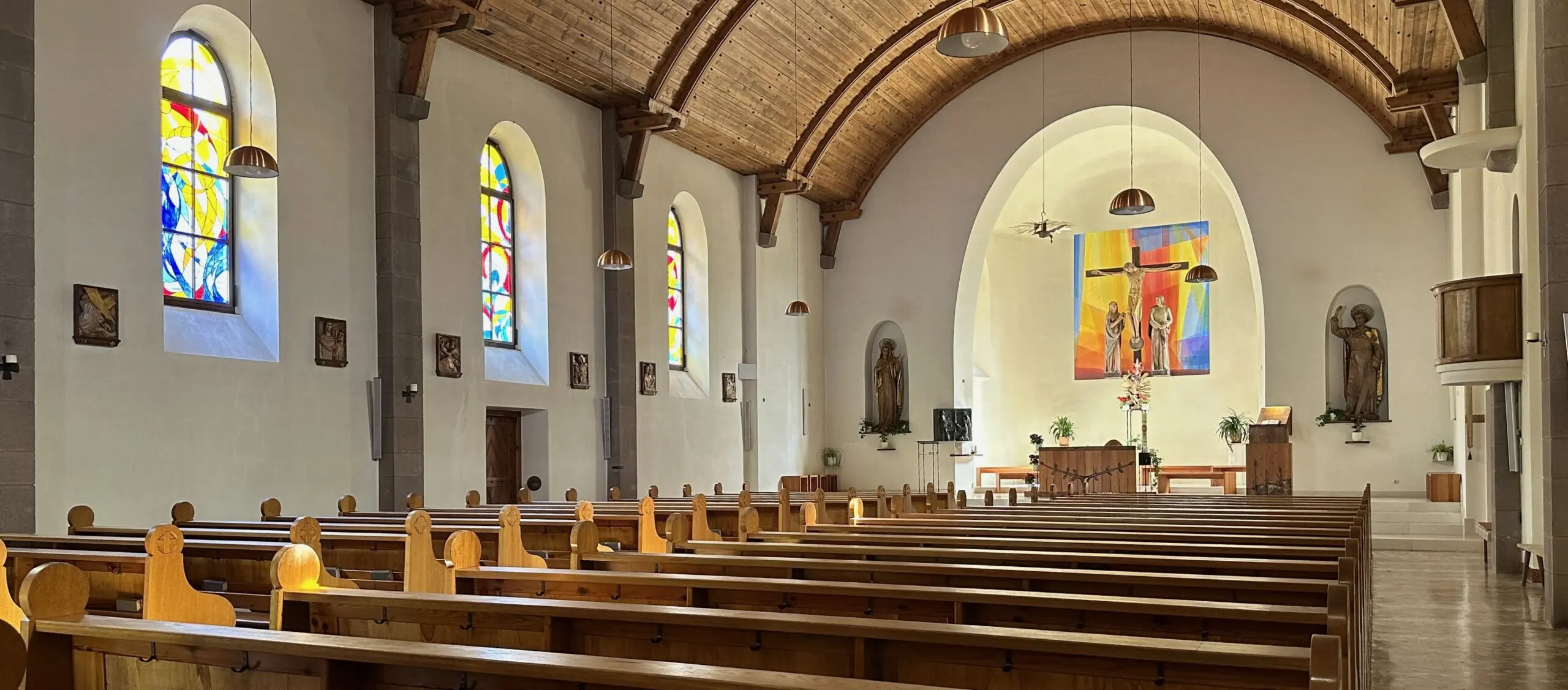 Interior of a church with stained glass.