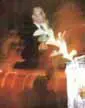 Person performing magic trick with fire.
