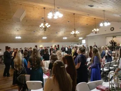 People gathered in a large indoor event.