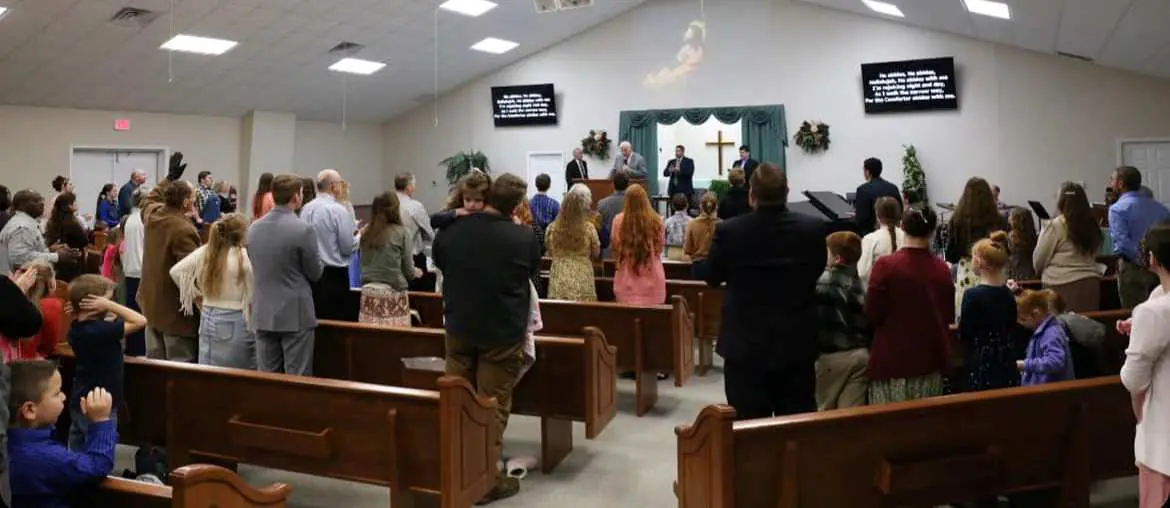 Congregation standing in church during worship service