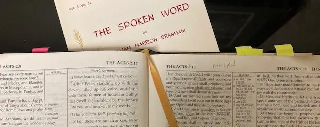 Open Bible with "The Spoken Word" booklet