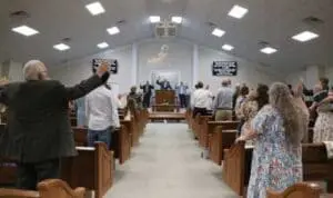 Congregation standing in church worship service