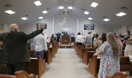 Congregation standing in church worship service