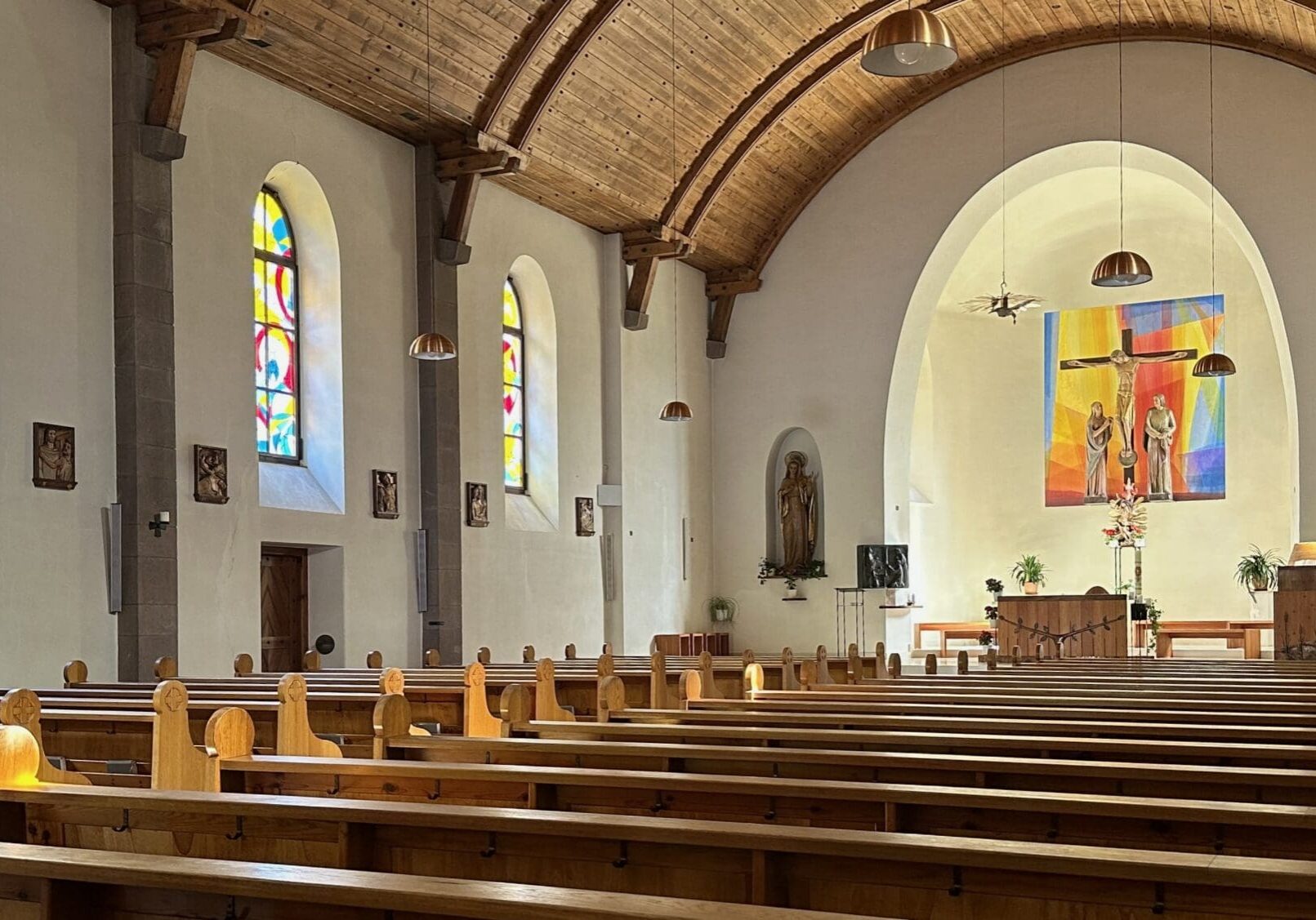 Interior of a church with stained glass.