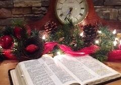 Open book with festive clock and decorations.