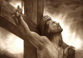 Man on cross with crown of thorns.