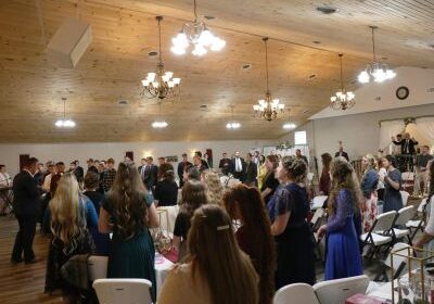 People gathered in a large indoor event.